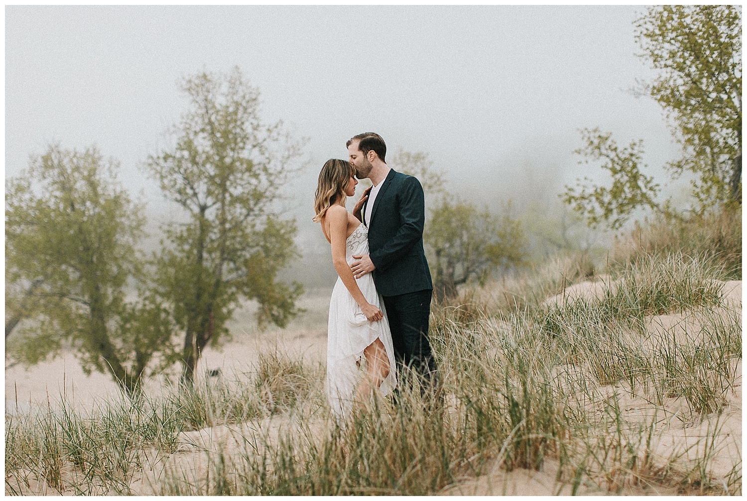 foggy engagement pictures in the dunes of Lake Michigan