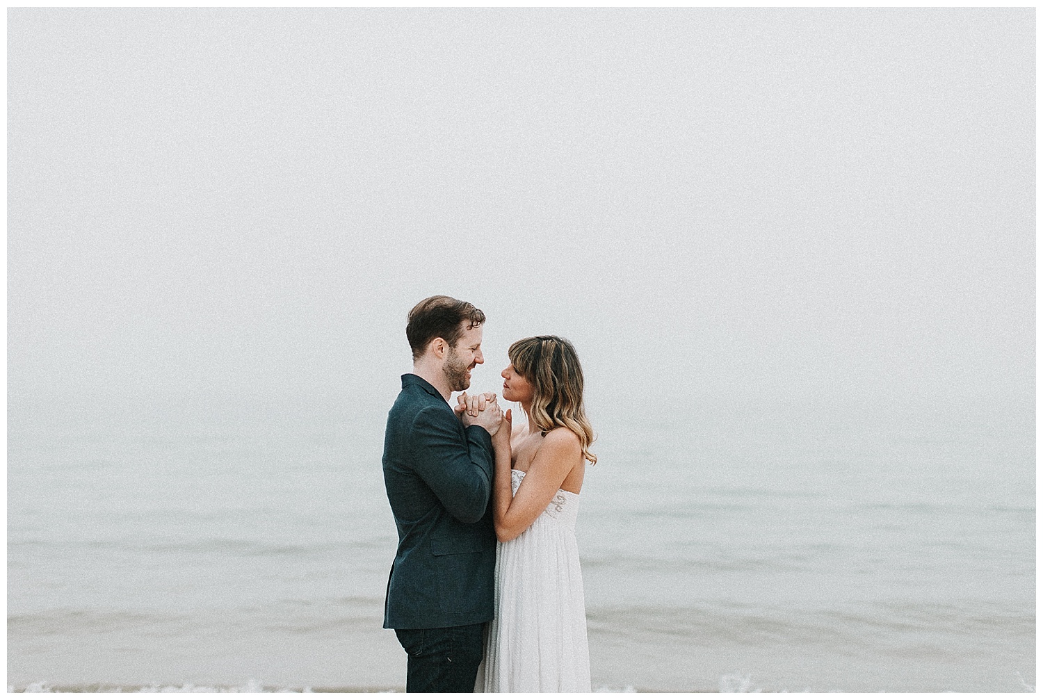 cozy engagement pictures on Lake Michigan