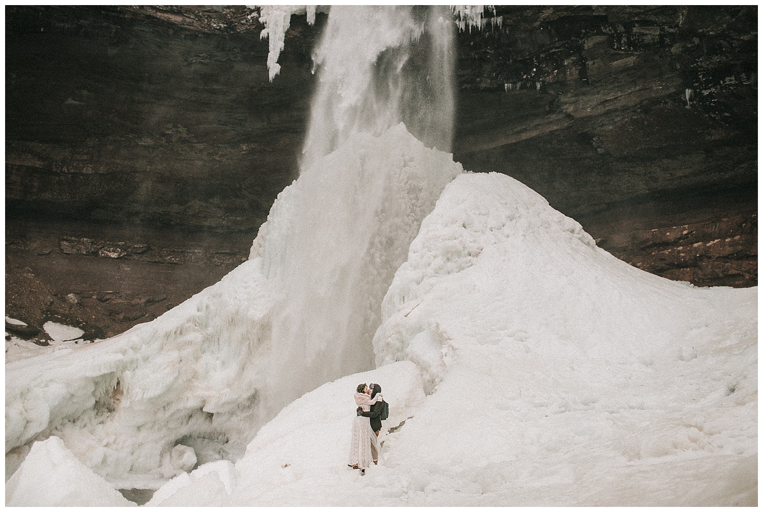 bride and groom on an icy waterfall in the Catskills