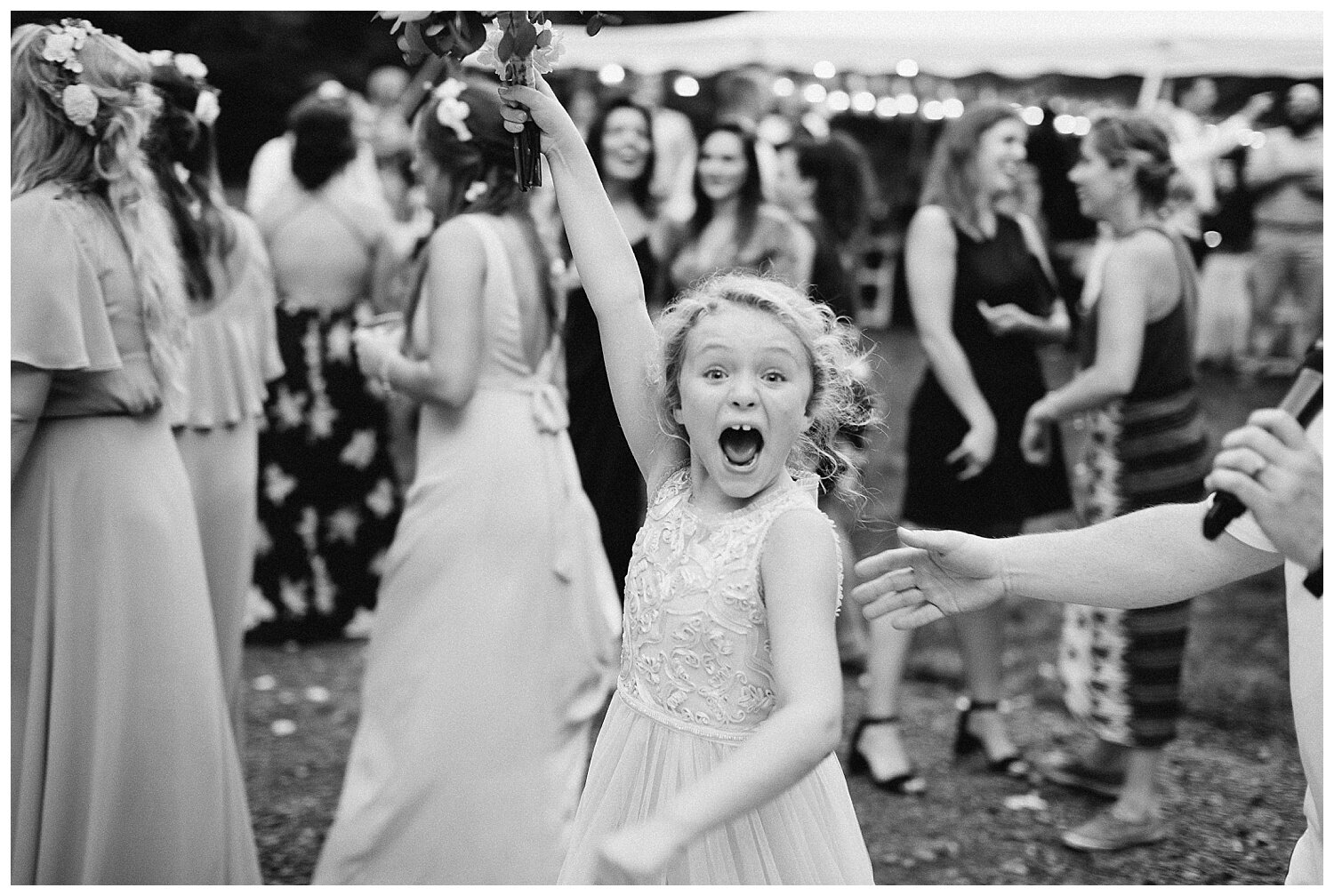 flower girl catching the bouquet