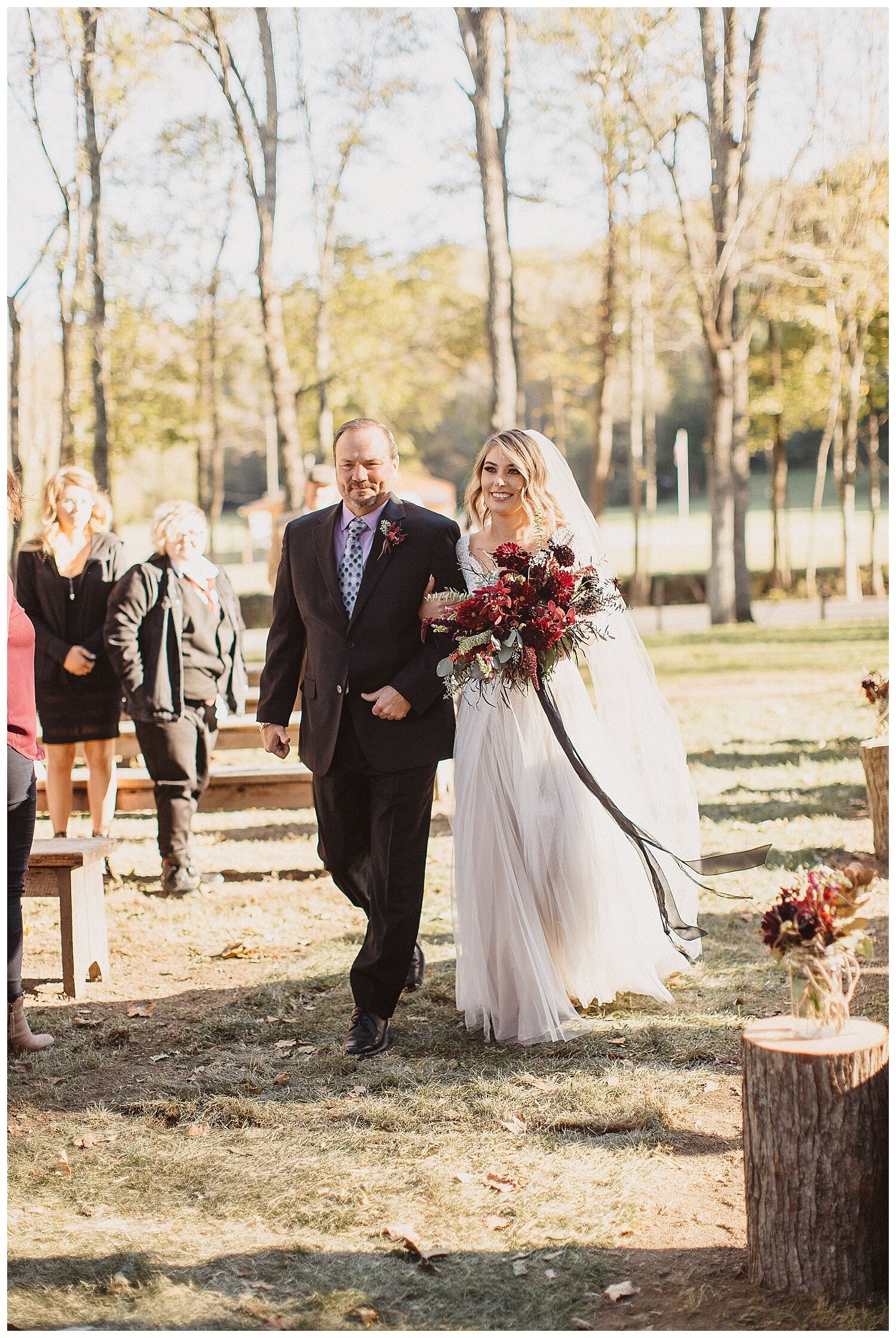 bride and her father walking down the aisle