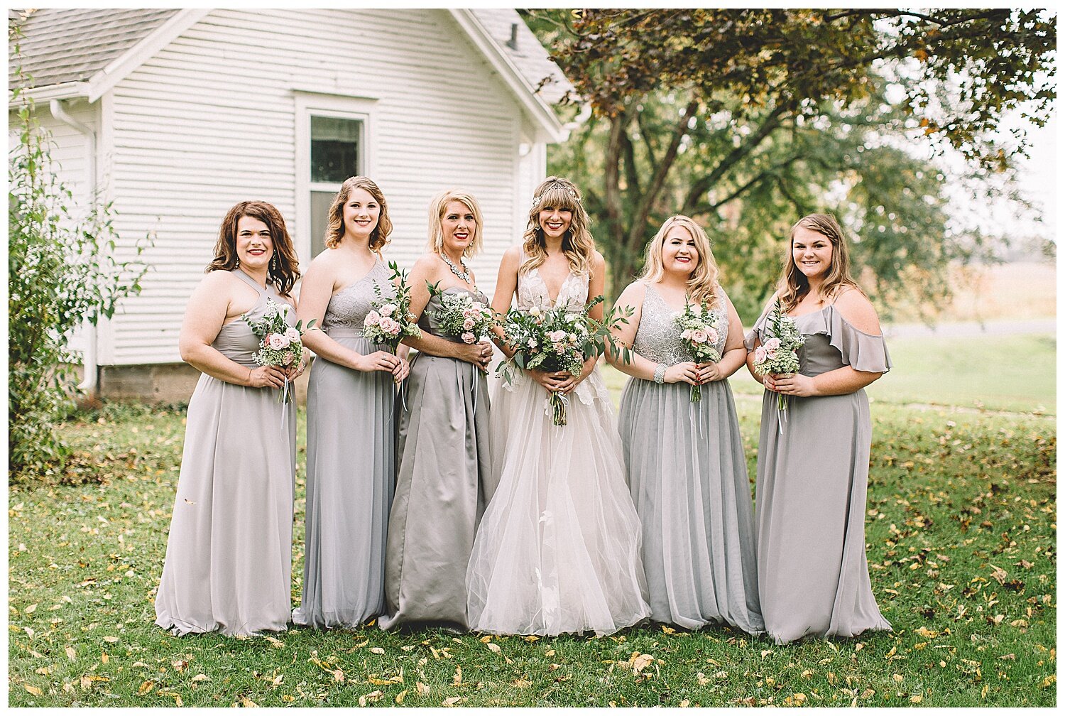 bridesmaids in pale blue gowns