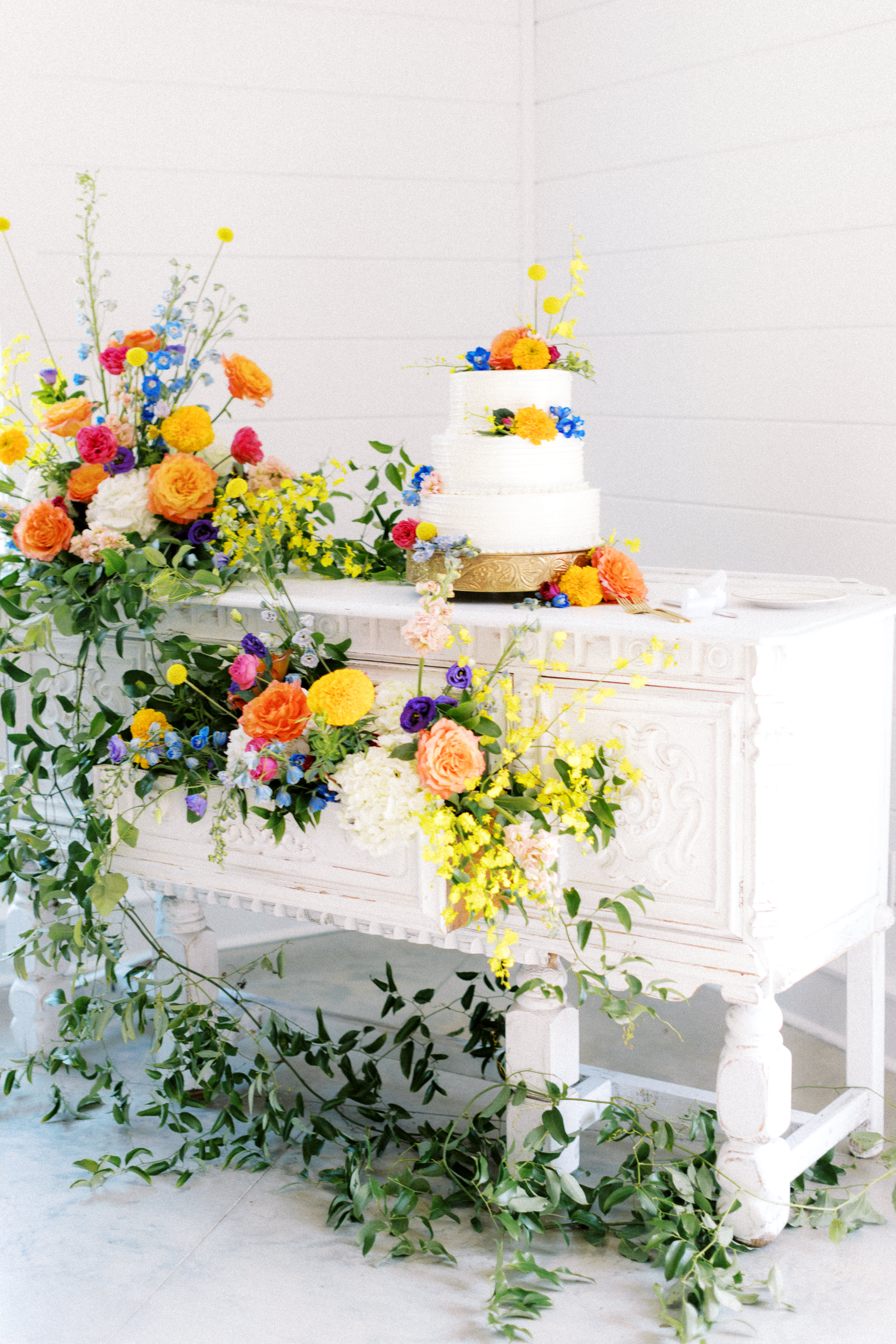 Colorful floral installation on cake table